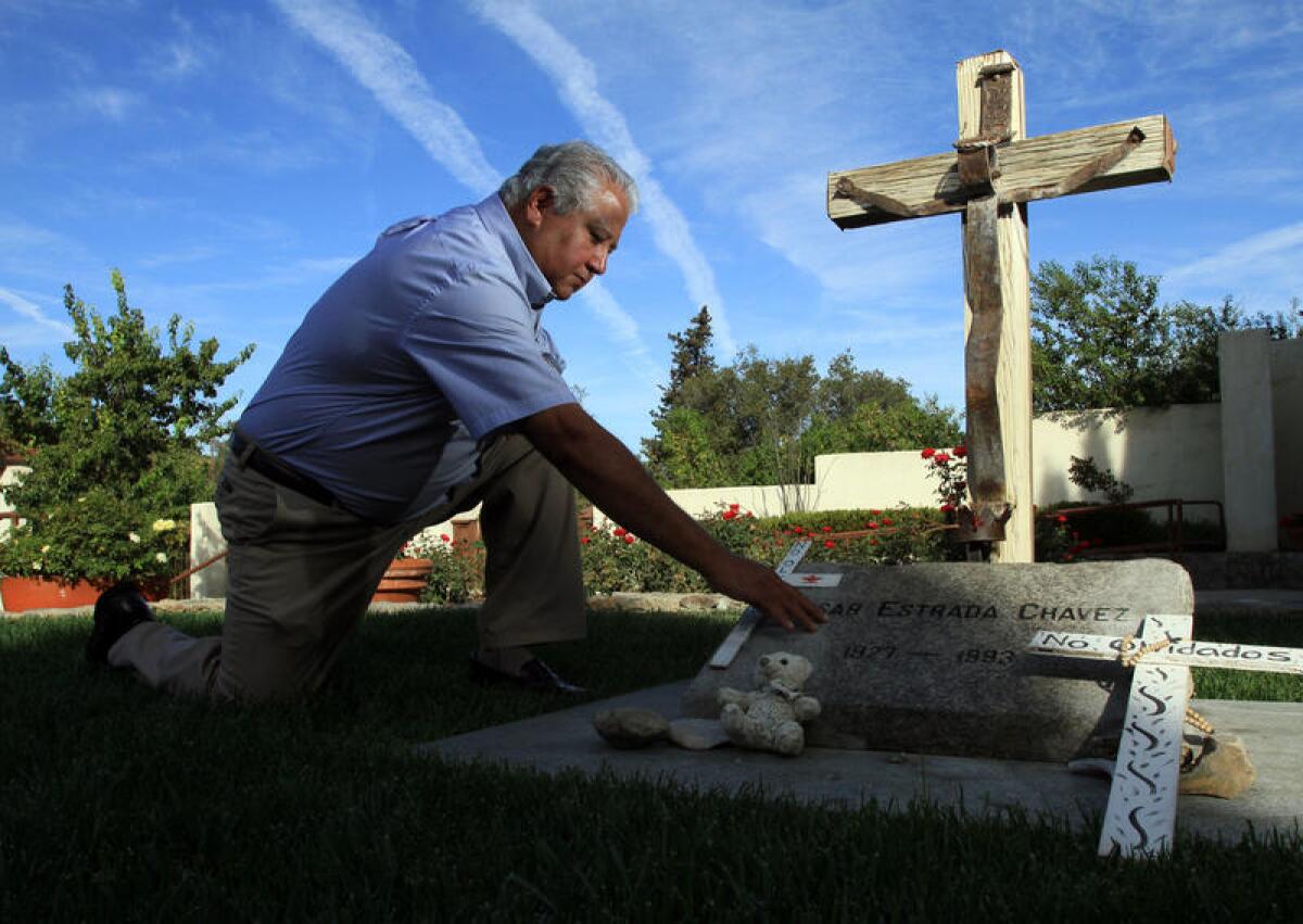 Paul Chavez at the grave of his father, labor leader Cesar Chavez.