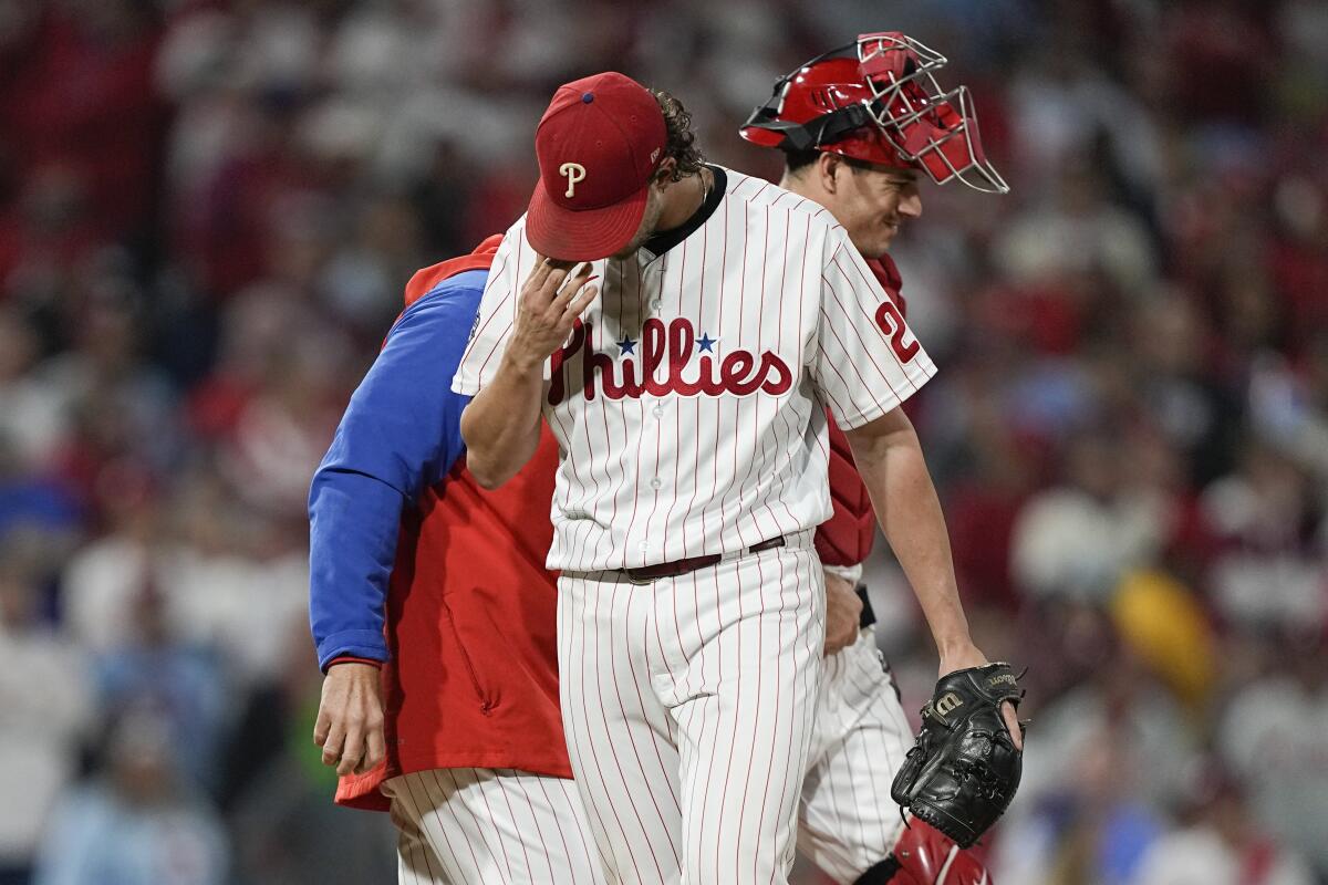Philadelphia Phillies starting pitcher Aaron Nola leaves the game with bases loaded during the fifth inning in Game 4 of baseball's World Series between the Houston Astros and the Philadelphia Phillies on Wednesday, Nov. 2, 2022, in Philadelphia. (AP Photo/David J. Phillip)