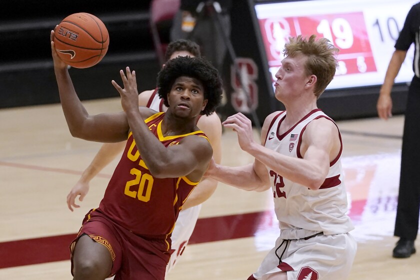USC guard Ethan Anderson drives to the basket against Stanford forward James Keefe.
