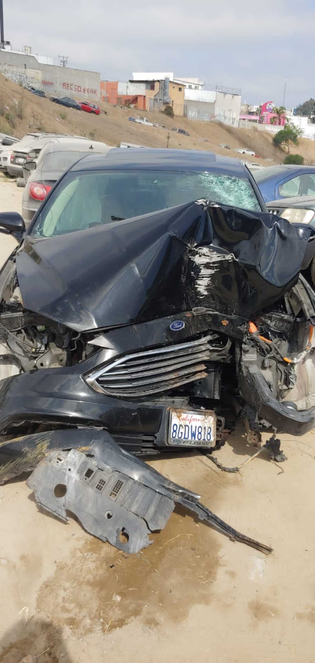 Renzzo Reyes' car cleared the center divider of the highway and hit a tree. Pictured is his car after the accident.
