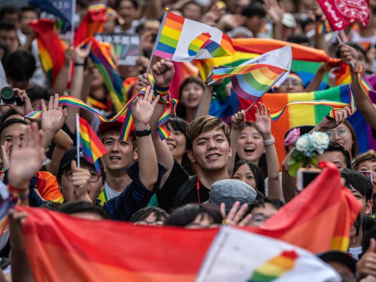 People celebrate after Taiwan's parliament voted to legalise same-sex marriage in Taipei, Taiwan.