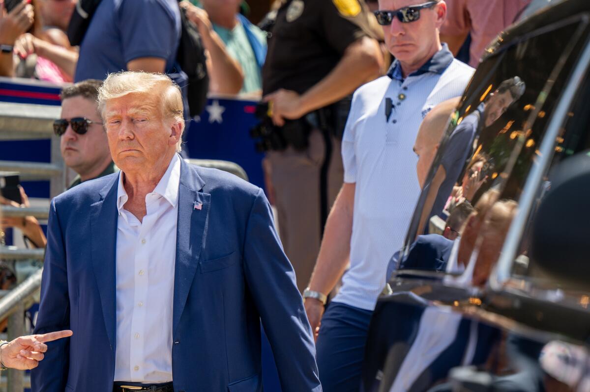 Former President Trump leaving the Iowa State Fair in Des Moines on Aug. 12