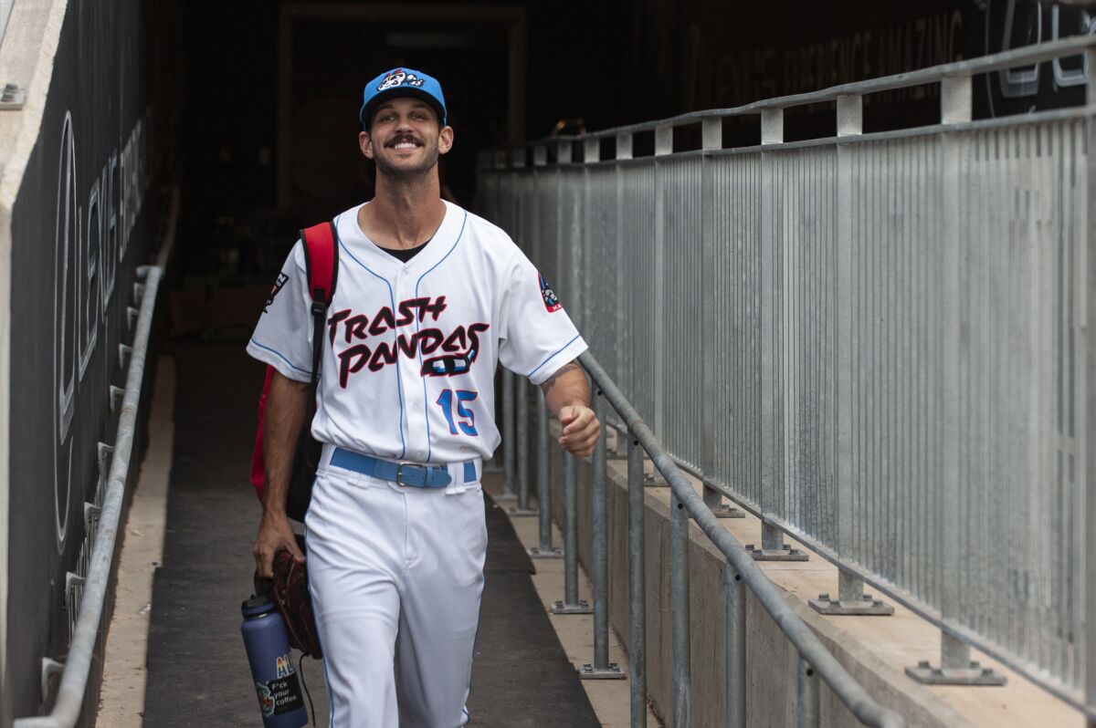 Rocket City Trash Pandas pitcher Kieran Lovegrove walks to the field