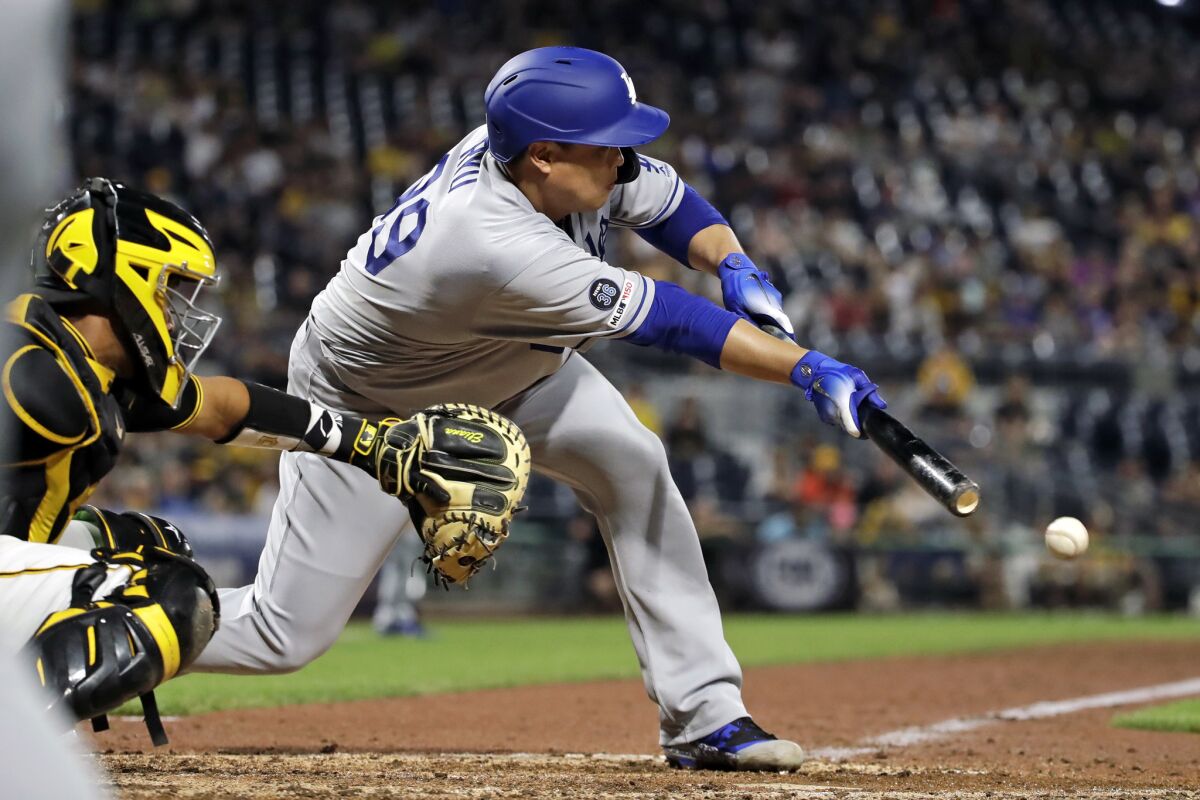 Hyun-Jin Ryu lays down a sacrifice bunt against the Pirates on May 25.