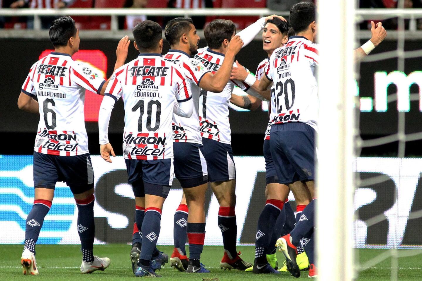 Alan Pulido (R) of Guadalajara celebrates his goal against Tijuana with teammates during their Mexican Clausura 2019 tournament football match at Akron stadium in Guadalajara, Jalisco State, Mexico on January 5, 2019. (Photo by Ulises Ruiz / AFP)ULISES RUIZ/AFP/Getty Images ** OUTS - ELSENT, FPG, CM - OUTS * NM, PH, VA if sourced by CT, LA or MoD **