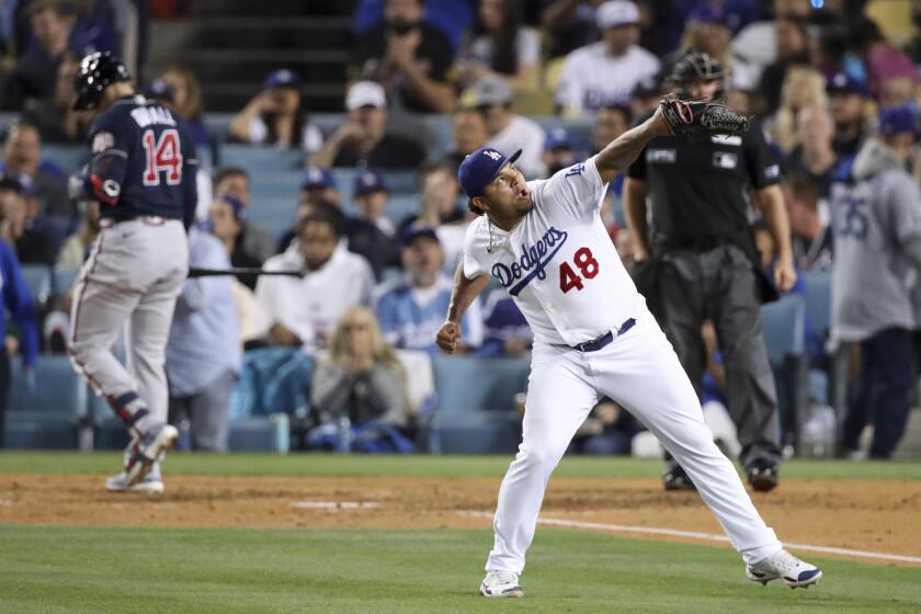 Los Angeles, CA - October 21: Los Angeles Dodgers relief pitcher Brusdar Graterol reacts after striking.