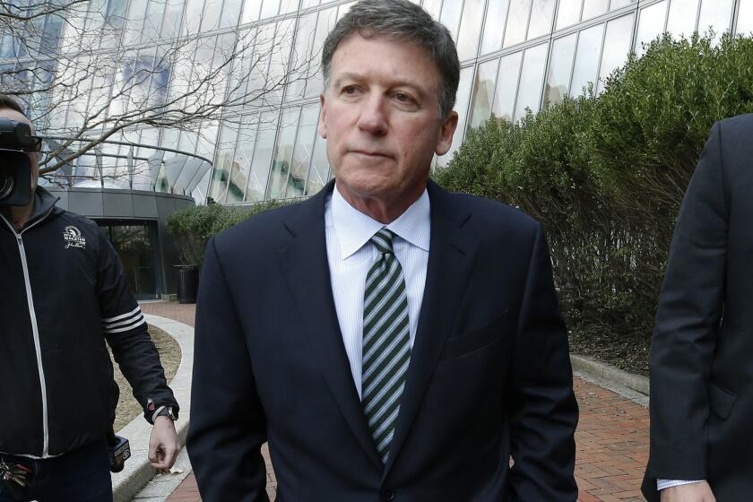 FILE - In this April 3, 2019 file photo, Bruce Isackson departs federal court in Boston after facing charges in a nationwide college admissions bribery scandal. In a court filing on Monday, April 8, 2019, Isackson agreed to plead guilty in the cheating scam. (AP Photos/Michael Dwyer, File)