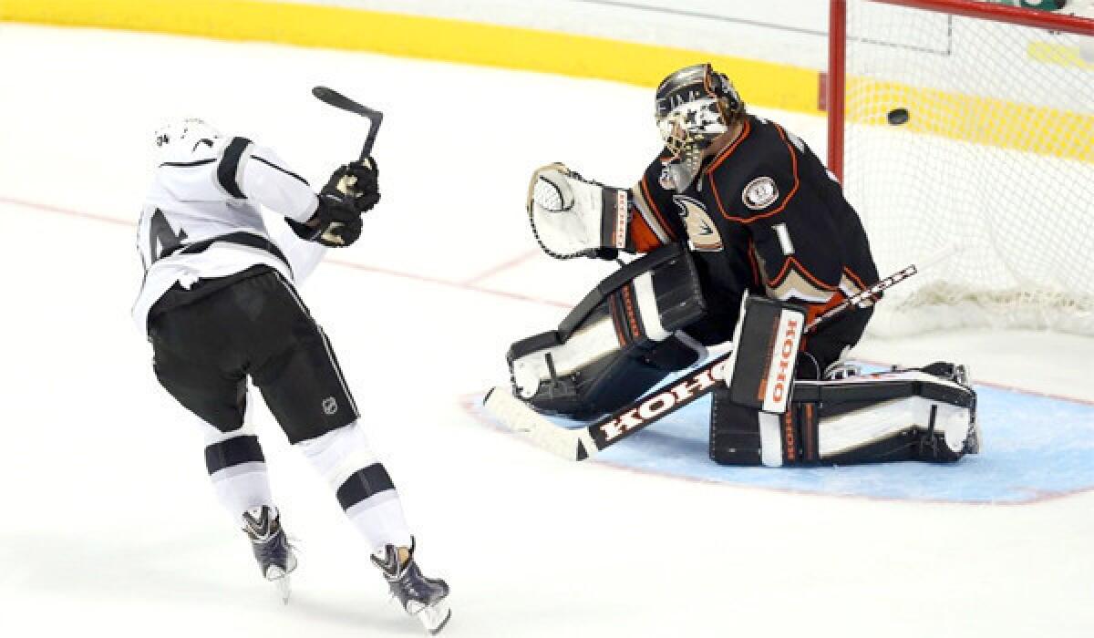 Dwight King scores the game-winning goal on Jonas Hiller in the ninth-round of the Kings' shootout victory Tuesday over the Ducks, 3-2, at the Honda Center.