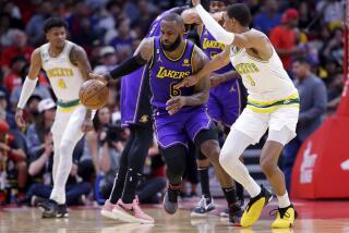 Los Angeles Lakers forward LeBron James (6) drives as Houston Rockets forward Jabari Smith Jr.