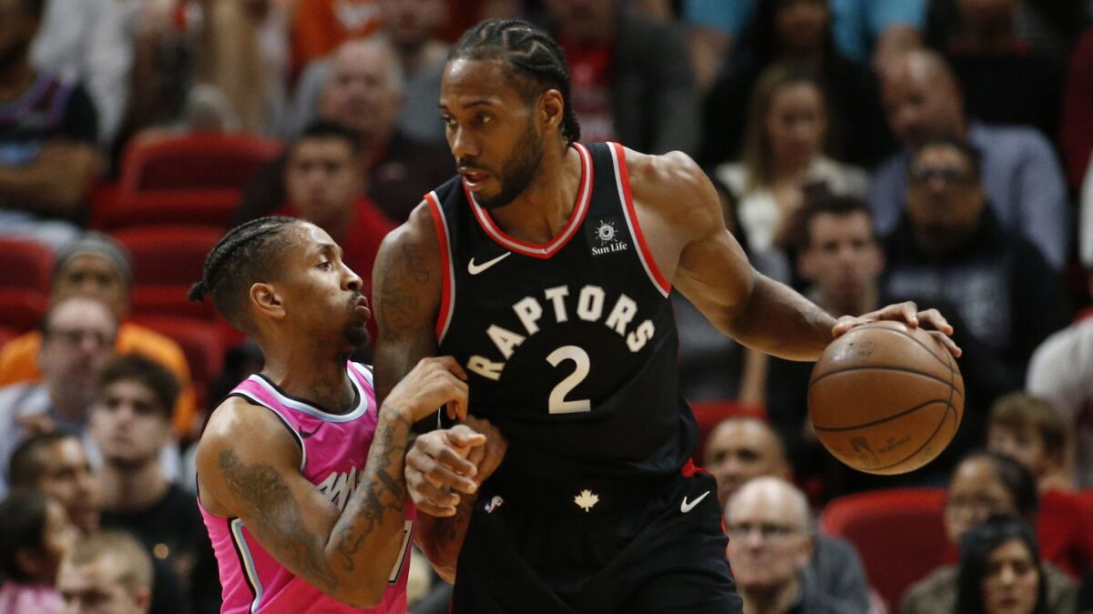 Miami Heat guard Rodney McGruder (17) defends against Toronto Raptors forward Kawhi Leonard (2) during the second half.