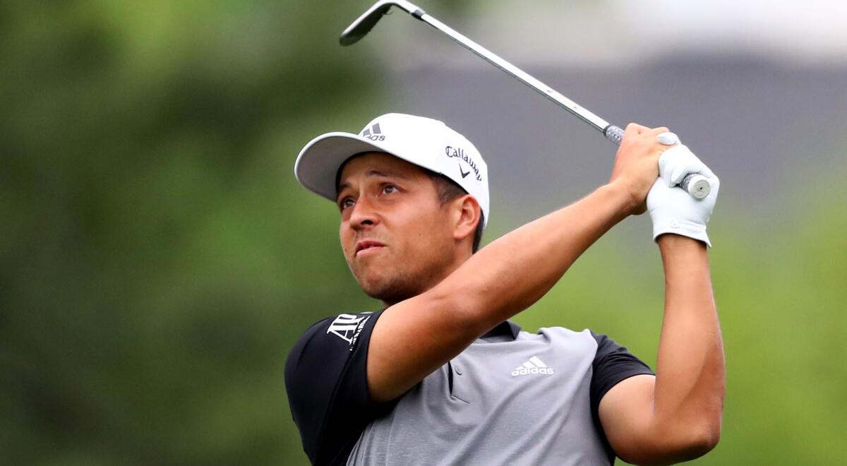 Xander Schauffele hits his approach shot on No. 1 during the final round of the Masters on Sunday.