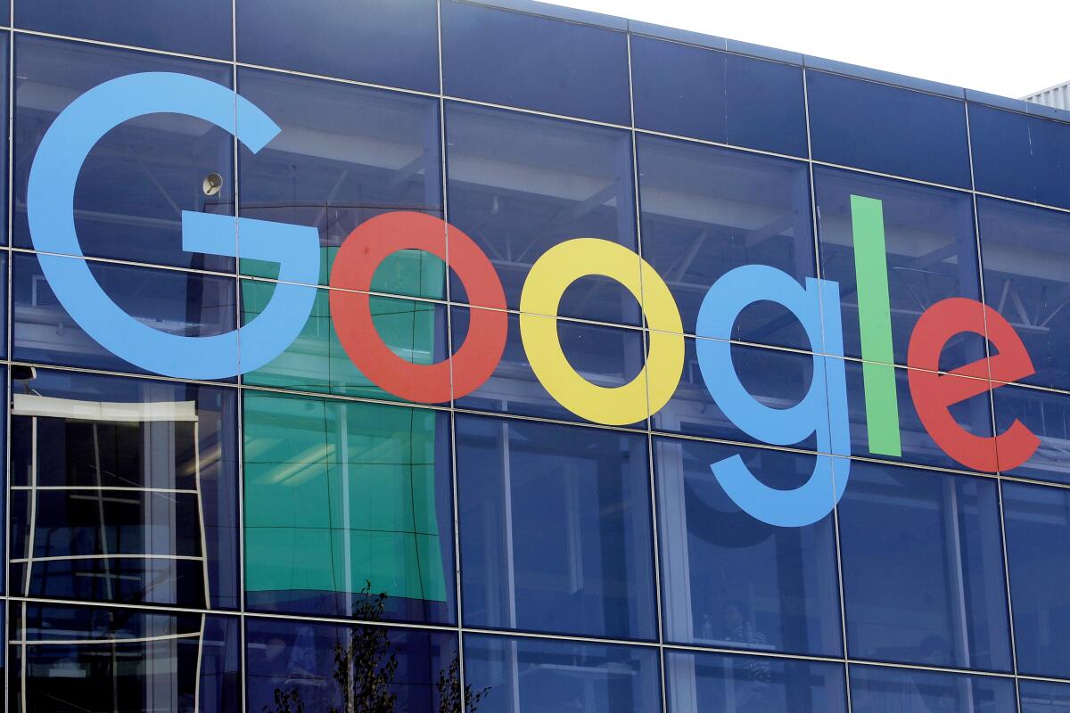 FILE - A sign is shown on a Google building at their campus in Mountain View, Calif., on Sept. 24, 2019. Hundreds of Google employees are petitioning the company to extend its abortion healthcare benefits to contract workers and to strengthen privacy protections for Google users searching for abortion information online. (AP Photo/Jeff Chiu, File)