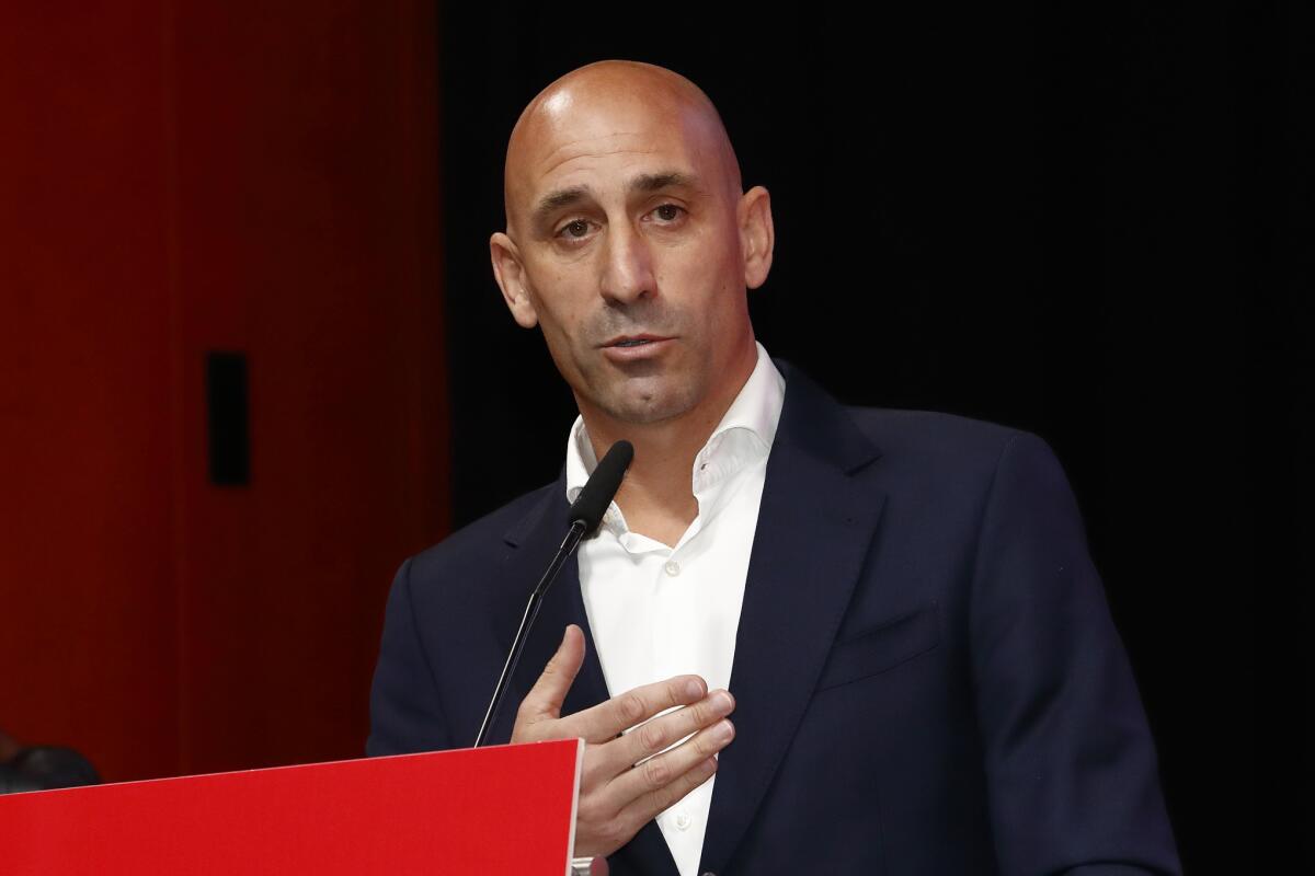 Luis Rubiales speaks into a microphone