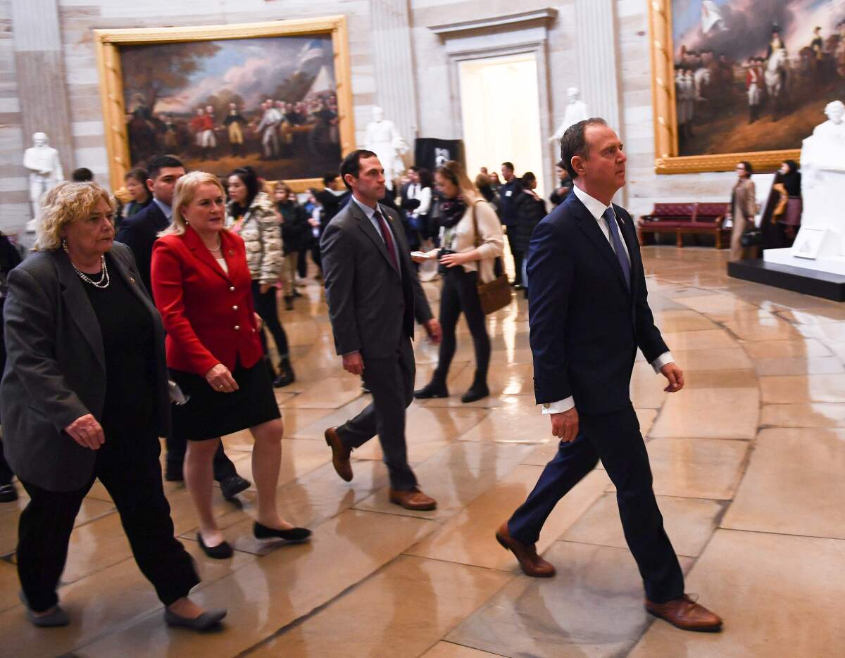 Rep. Adam Schiff leads the House impeachment managers through the Capitol rotunda for the Trump impeachment vote.
