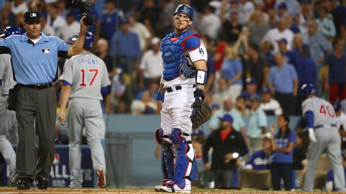 Yasmani Grandal shows frustration after a series of errors leads to a five run sixth inning for the Cubs.
