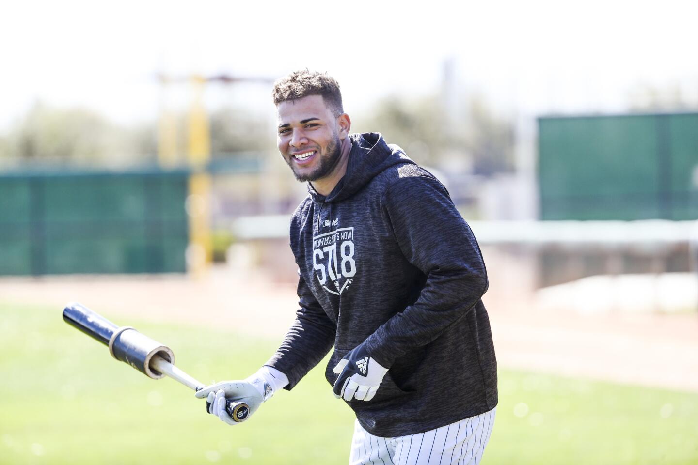Yoan Moncada laughs while waiting to bat during White Sox spring training at Camelback Ranch on Feb. 21, 2018, in Glendale, Ariz.