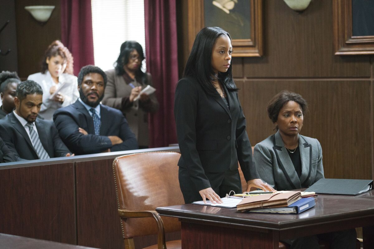 Donovan Christie Jr., from left, Tyler Perry , Bresha Webb and Crystal Fox in the movie 'A Fall From Grace'