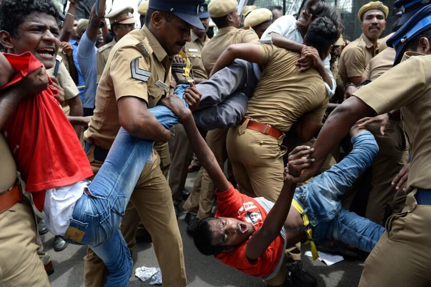 (FILES) This file photo taken on May 31, 2017 shows Indian police removing members of the Revolutionary Students and Youth Front during a protest against Prime Minister Narendra Modi and the ban on the sale of cows for slaughter in Chennai. India's top court on July 11, 2017 stayed a nationwide ban imposed by Prime Minister Narendra Modi's government on the sale of cattle for slaughter that had provoked outcry in many states. / AFP PHOTO / ARUN SANKARARUN SANKAR/AFP/Getty Images ** OUTS - ELSENT, FPG, CM - OUTS * NM, PH, VA if sourced by CT, LA or MoD **