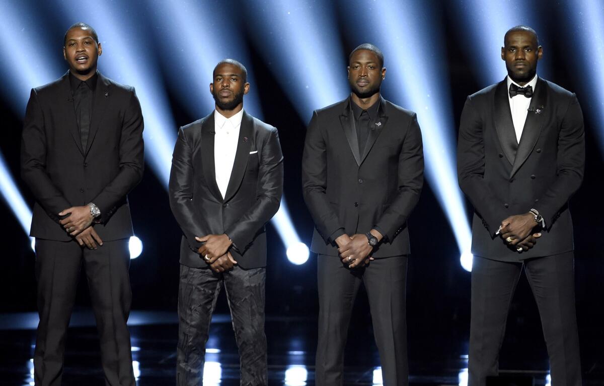Carmelo Anthony, from left, Chris Paul, Dwyane Wade and LeBron James speak on stage at the ESPY Awards at the Microsoft Theater