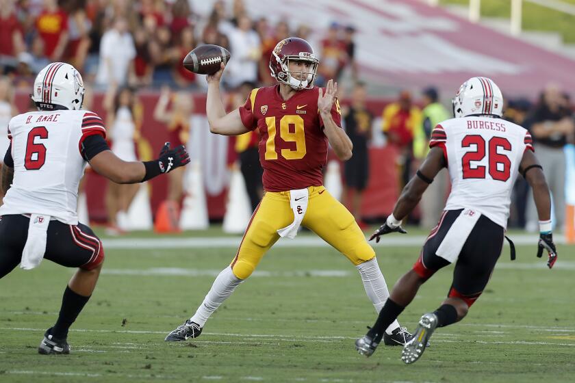 LOS ANGELES, CALIF. - SEP. 20, 2019. USC quarterback Matt Fink throws downfield against Utah in the first quarter at the L.A. Memorial Coliseum on Friday night, Sep. 20, 2019. (Luis Sinco/Los Angeles Times)