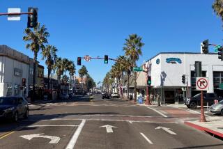 North Coast Highway at Mission Avenue, where the city's landmark sign stood in the 1920s.