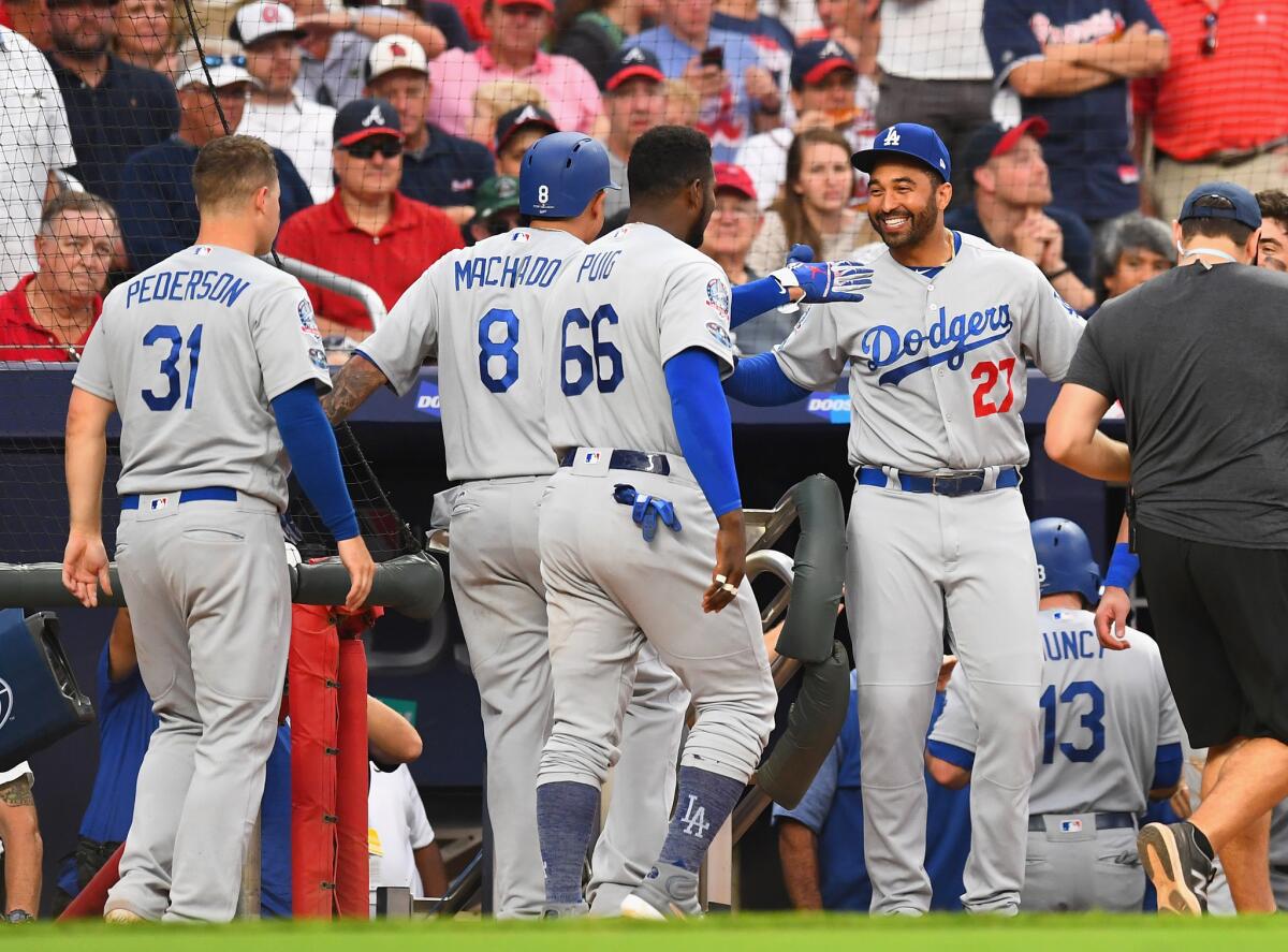 Manny Machado, second from left, celebrates his three-run home run with teammate Matt Kemp.