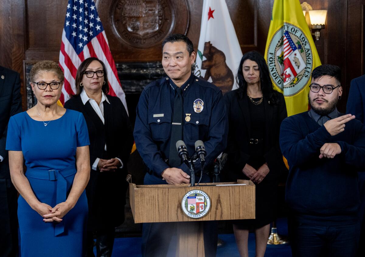 Assistant Chief Dominic H. Choi, center, was named new LAPD interim chief, effective March 1.