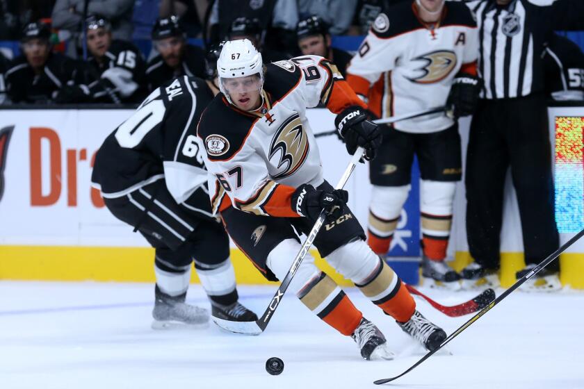 Ducks center Rickard Rakell (67) skates with the puck against the Kings during a preseason game on Sept. 29.