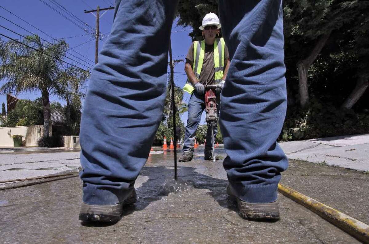 A crew with the Los Angeles Department of Water and Power works in Encino.