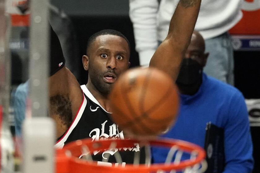Clippers forward Patrick Patterson watches his three-point shot go through the hoop.