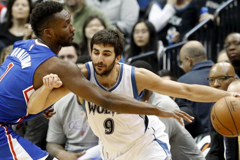 Clippers swingman Jordan Hamilton, left, tries to steal the ball from Timberwolves guard Ricky Rubio during a 110-105 victory in Minneapolis on March 2.