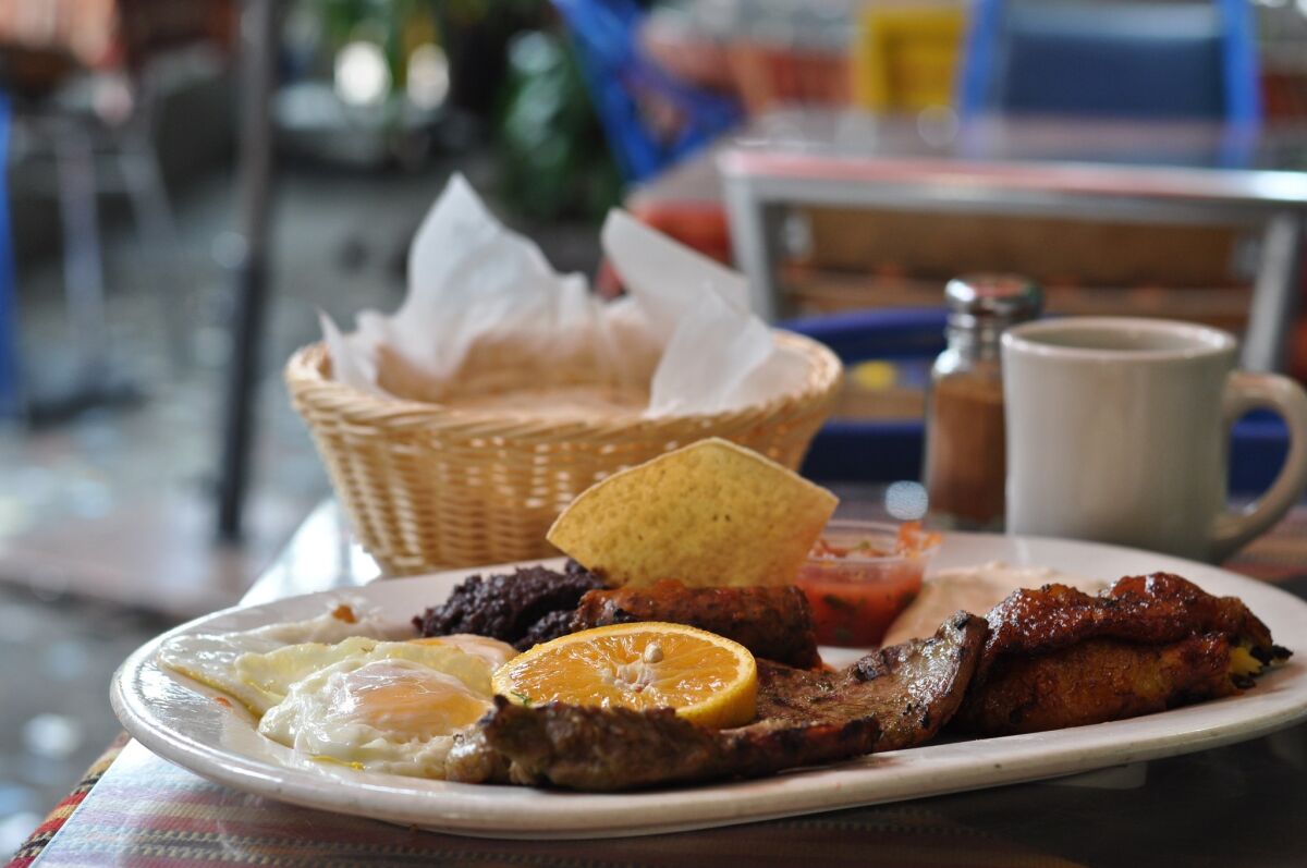 Amalia’s signature breakfast is gargantuan -- steak, longaniza, fried plantains, eggs, black beans, crema and bread or tortillas.