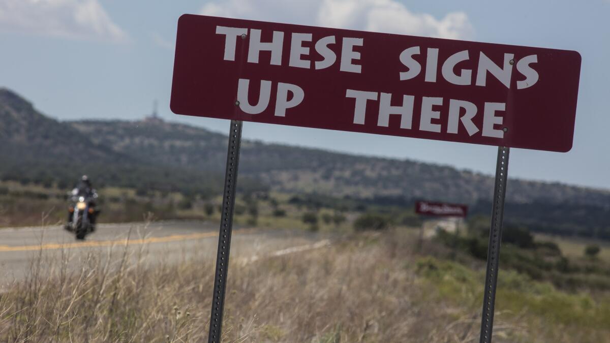 Steel reproductions of Burma Shave Sign along the historic Route 66 near Ash Fork, Arizona. (Brian van der Brug / Los Angeles Times)