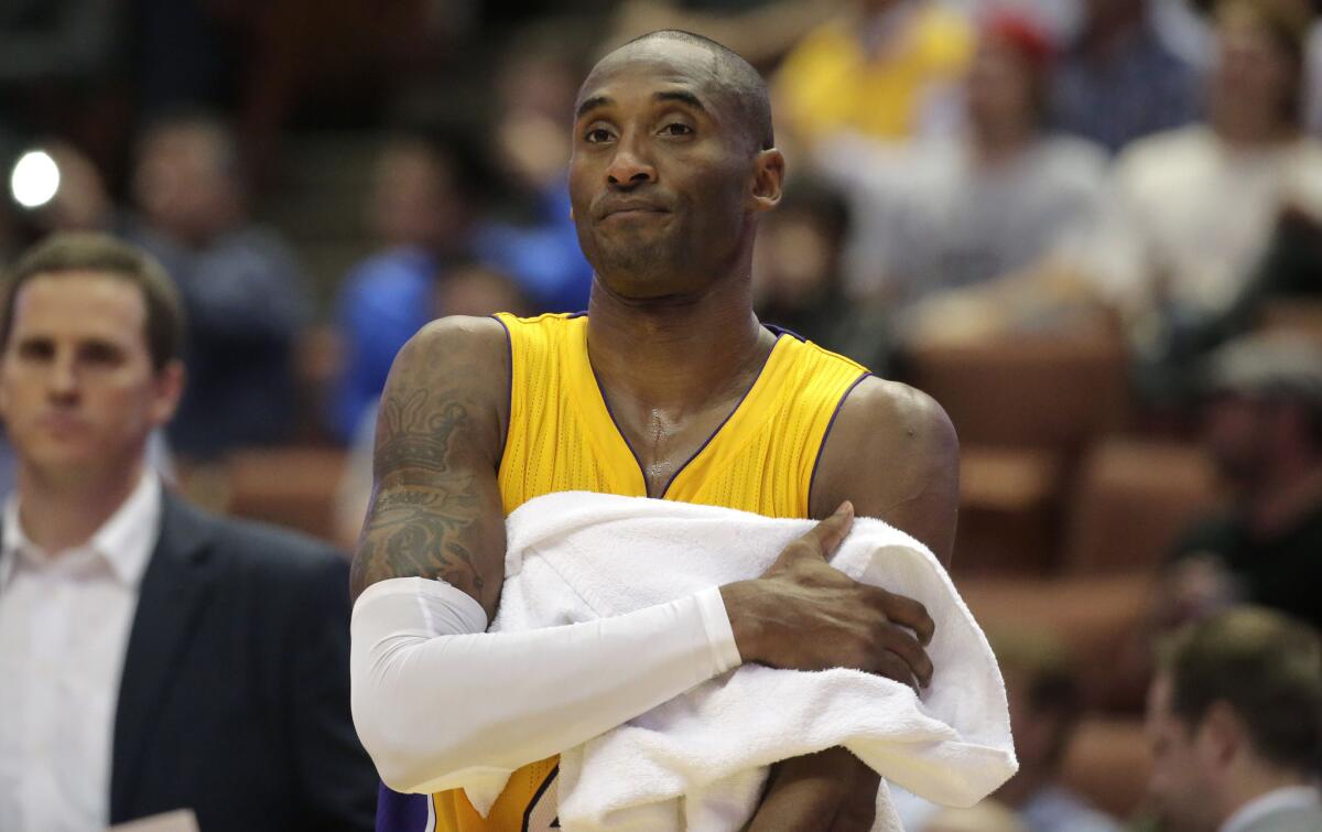 Lakers star Kobe Bryant looks on during an exhibition game against the Utah Jazz on Oct. 16.