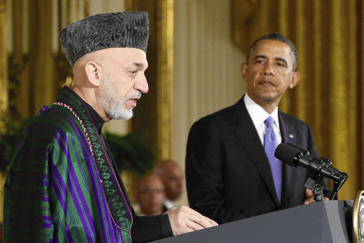 Afghan President Hamid Karzai speaks during a news conference last year at the White House with President Obama.