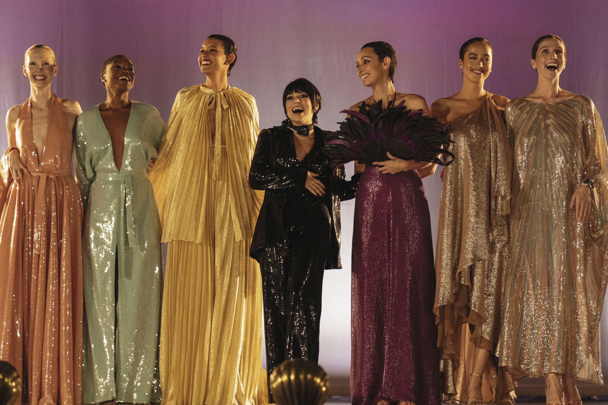 Krysta Rodriguez as Liza Minnelli on stage with Halston models  in "Halston." 