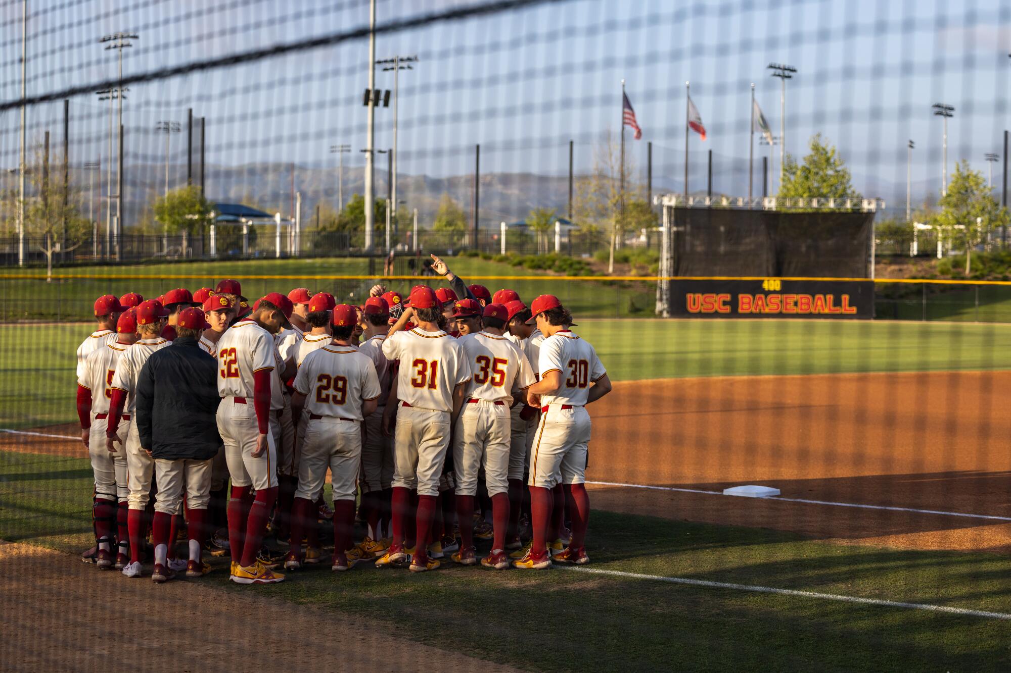 USC players huddle together before a game against Cal at Great Park in Irvine.