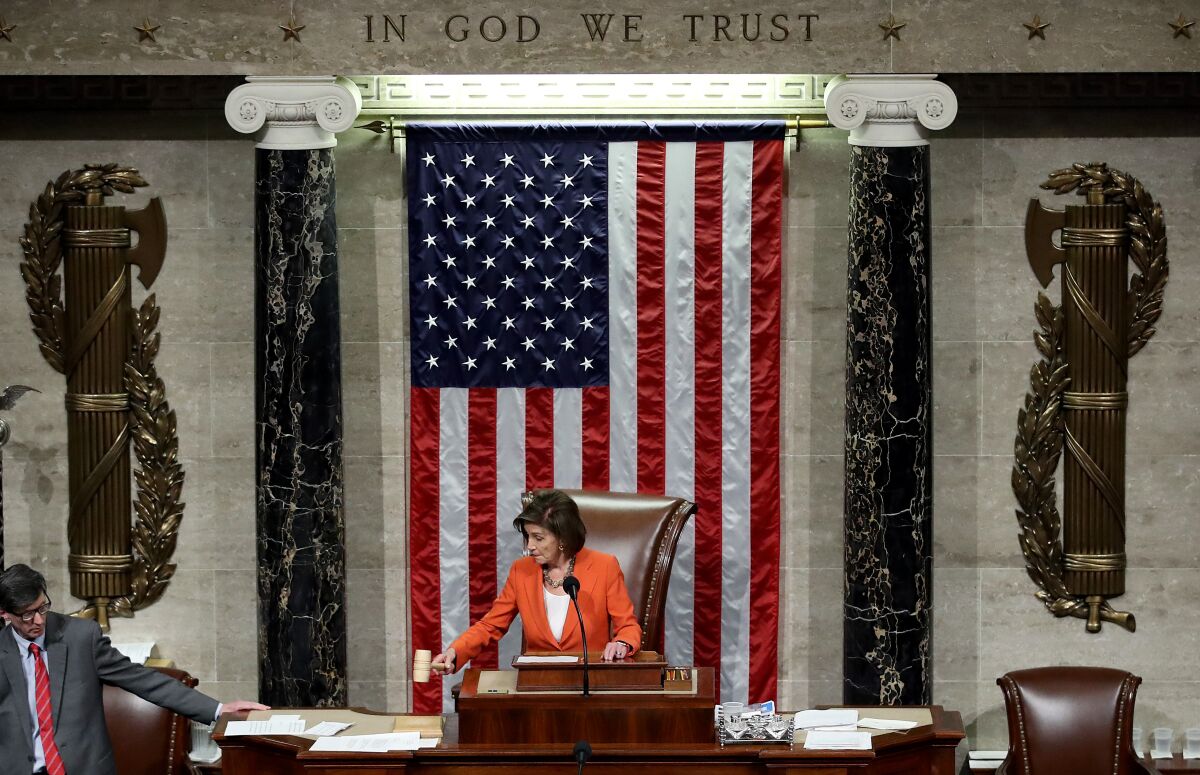 Speaker Nancy Pelosi, gavel in hand, presides over the House of Representatives.