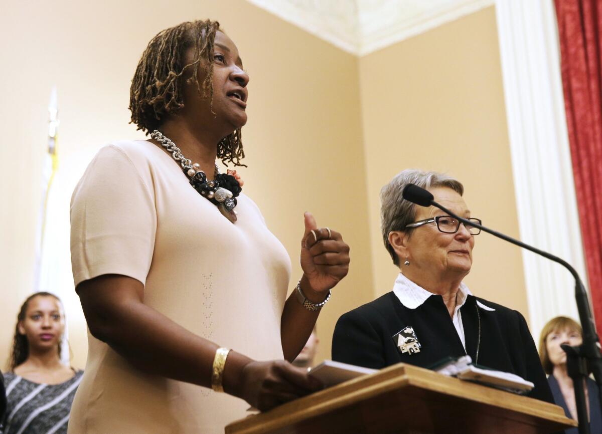 State Sens. Holly Mitchell (D-Los Angeles), left, and Loni Hancock (D-Berkeley) discuss their efforts to change Proposition 13 at a news conference at the Capitol on Wednesday.