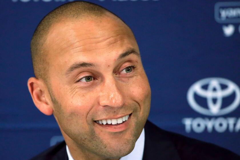 FILE - In this Sept. 28, 2014, file photo, New York Yankees' Derek Jeter speaks to the media after the last baseball game of his career, against the Boston Red Sox, at Fenway Park in Boston. Derek Jeter and Bruce Sherman are holding meetings Tuesday and Wednesday, Sept. 5-6, 2017, at Marlins Park to ease the transition in their investment group's pending purchase of the Miami Marlins, a person familiar with the discussions said. The person confirmed the meetings to The Associated Press on condition of anonymity because those involved have not commented. (AP Photo/Steven Senne, File)