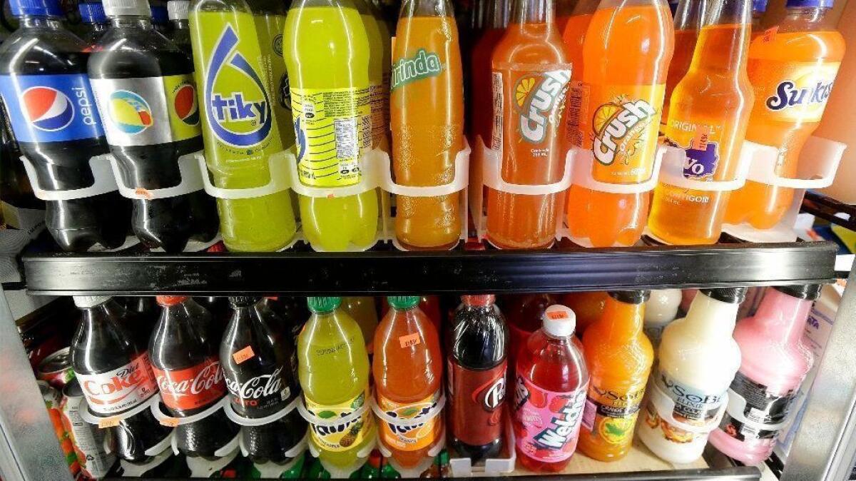 Sugary soft drinks fill a San Francisco market display case.