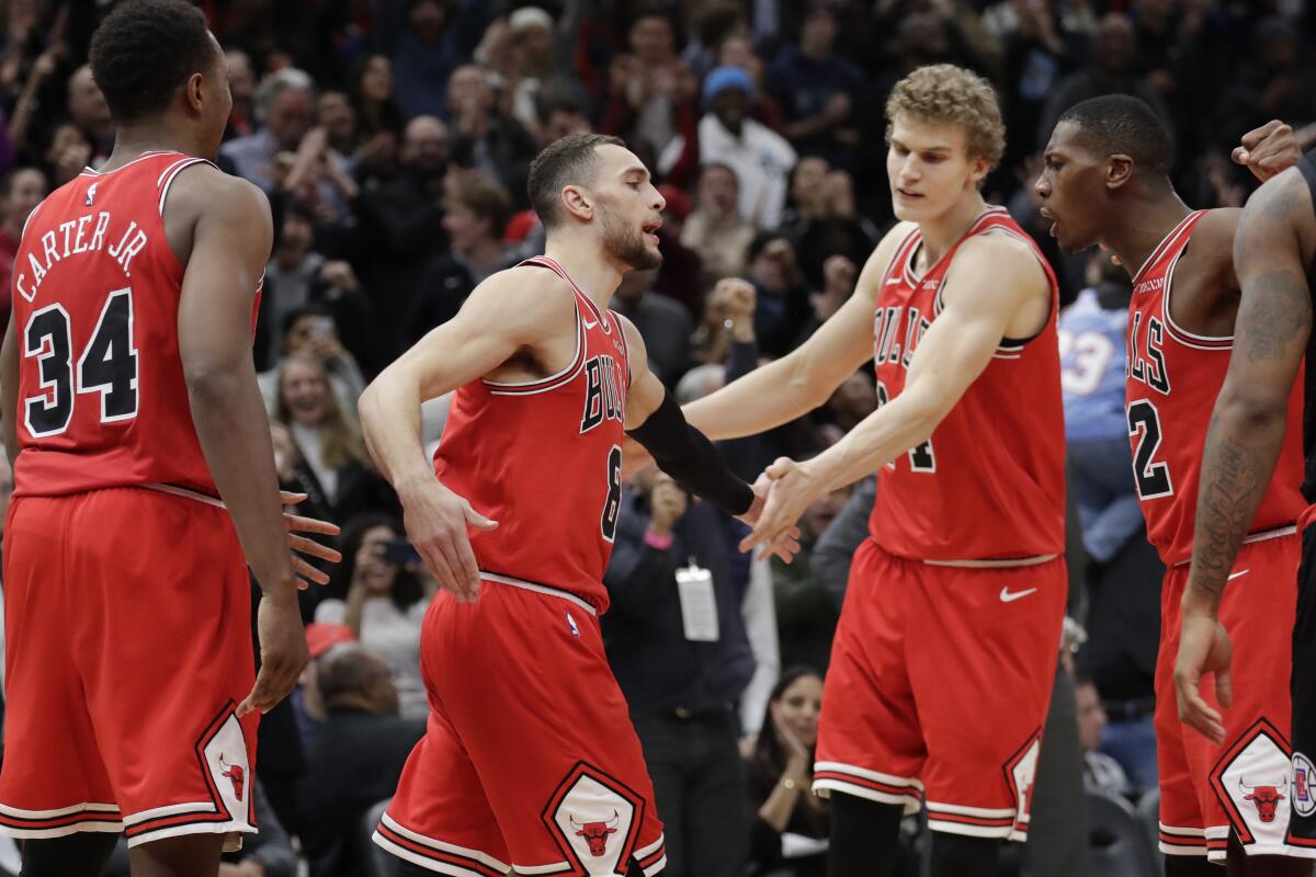 Bulls guard Zach LaVine, second from left, celebrates his three-point play in the final seconds Dec. 14, 2019.