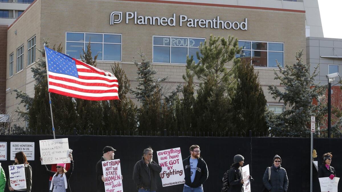 Abortion rights supporters rally outside a Colorado Planned Parenthood.