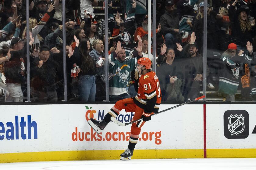 Anaheim Ducks center Leo Carlsson (91) celebrates his game-winning overtime goal against the Utah Hockey Club in an NHL game, Wednesday, Oct. 16, 2024, in Anaheim, Calif. (AP Photo/Kyusung Gong)