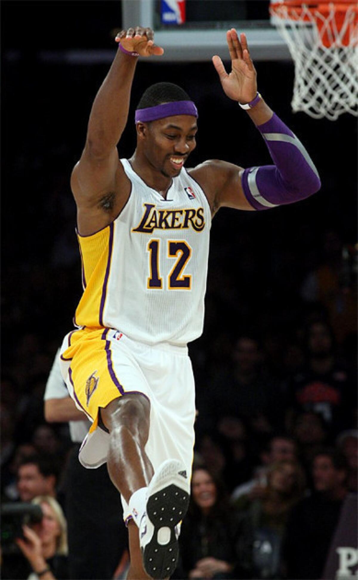 Dwight Howard celebrates after throwing down the dunk.