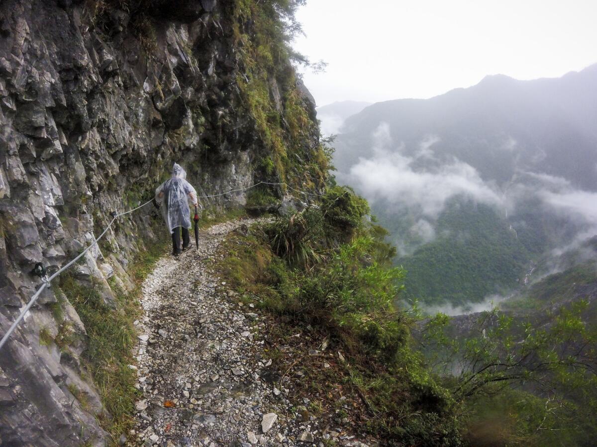 A guide hikes the Zhuilu Old Road trail in Taroko National Park, Taiwan.