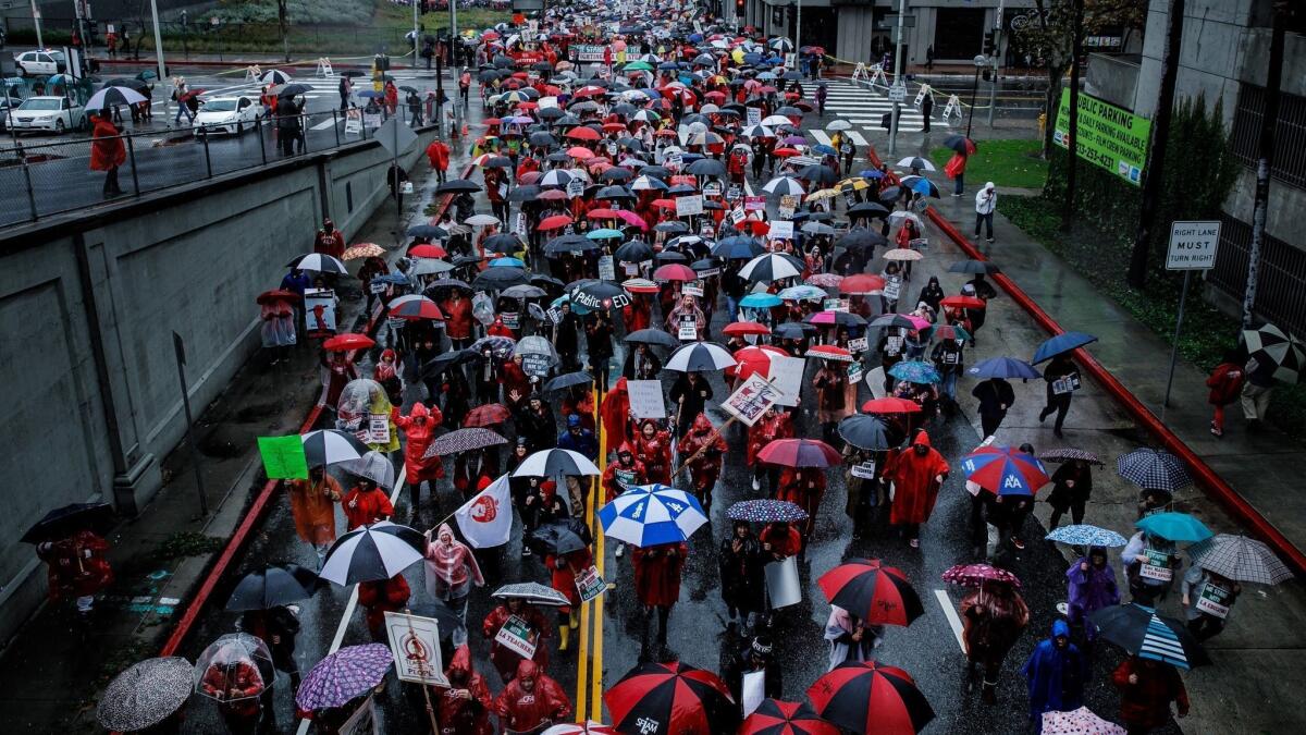 Educators, supporters and community members march through the 2nd street tunnel towards the LAUSD office during the UTLA strike in Los Angeles, Calif. on Monday.