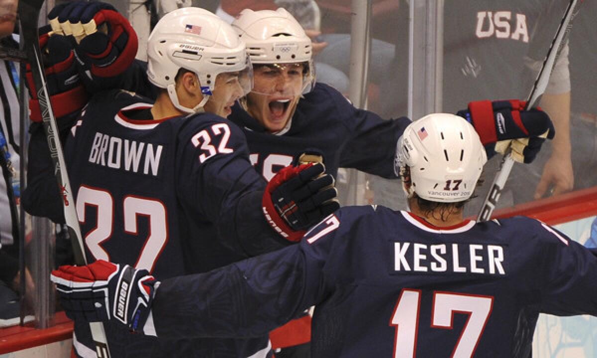 Team USA's Patrick Kane, center, celebrates with teammates Dustin Brown, left, and Ryan Kesler after scoring a goal against Finland at the 2010 Winter Olympic Games in Vancouver, Canada. Team USA hopes its speed will give them the edge in this year's Olympic tournament.
