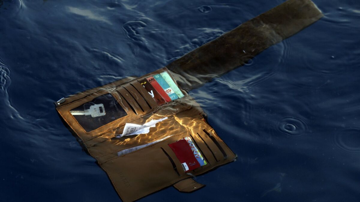 A wallet belonging to a victim of the Lion Air passenger jet that crashed in the waters of Ujung Karawang, Indonesia, on Monday.