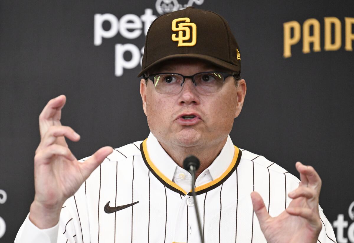 New San Diego Padres manager Mike Shildt wears a jersey and gestures with hands while speaking during a news conference